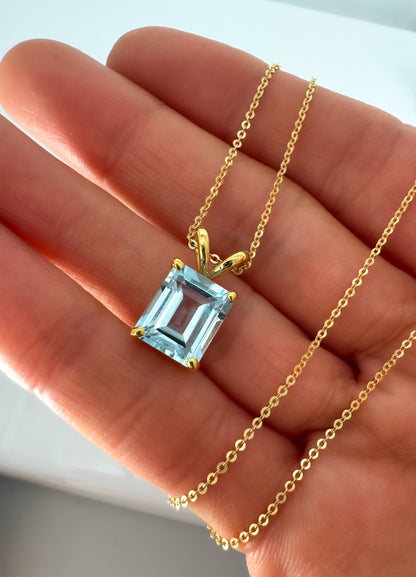 14K Gold Emerald Cut Sky Blue Topaz Pendant
