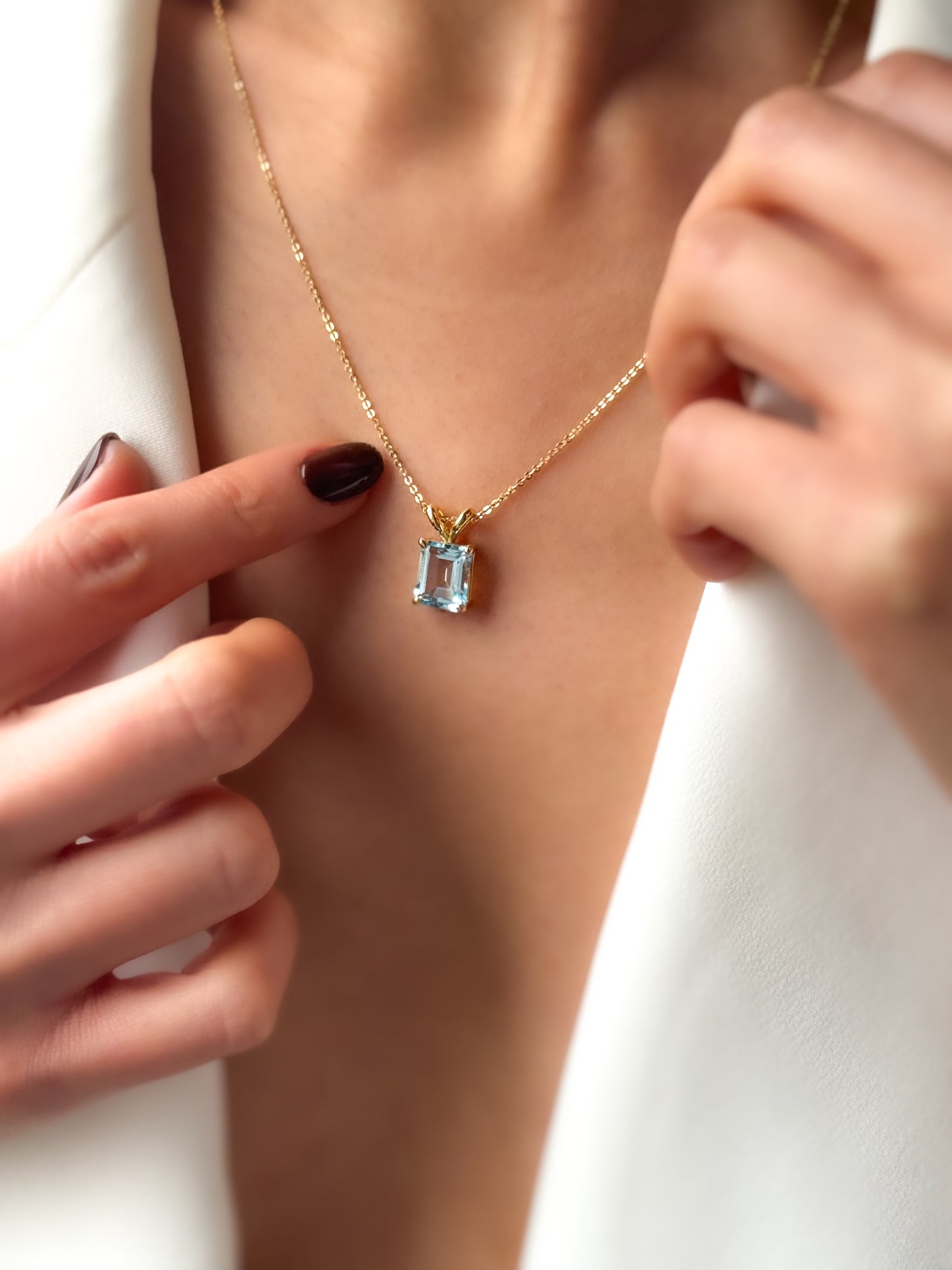 14K Gold Emerald Cut Sky Blue Topaz Pendant