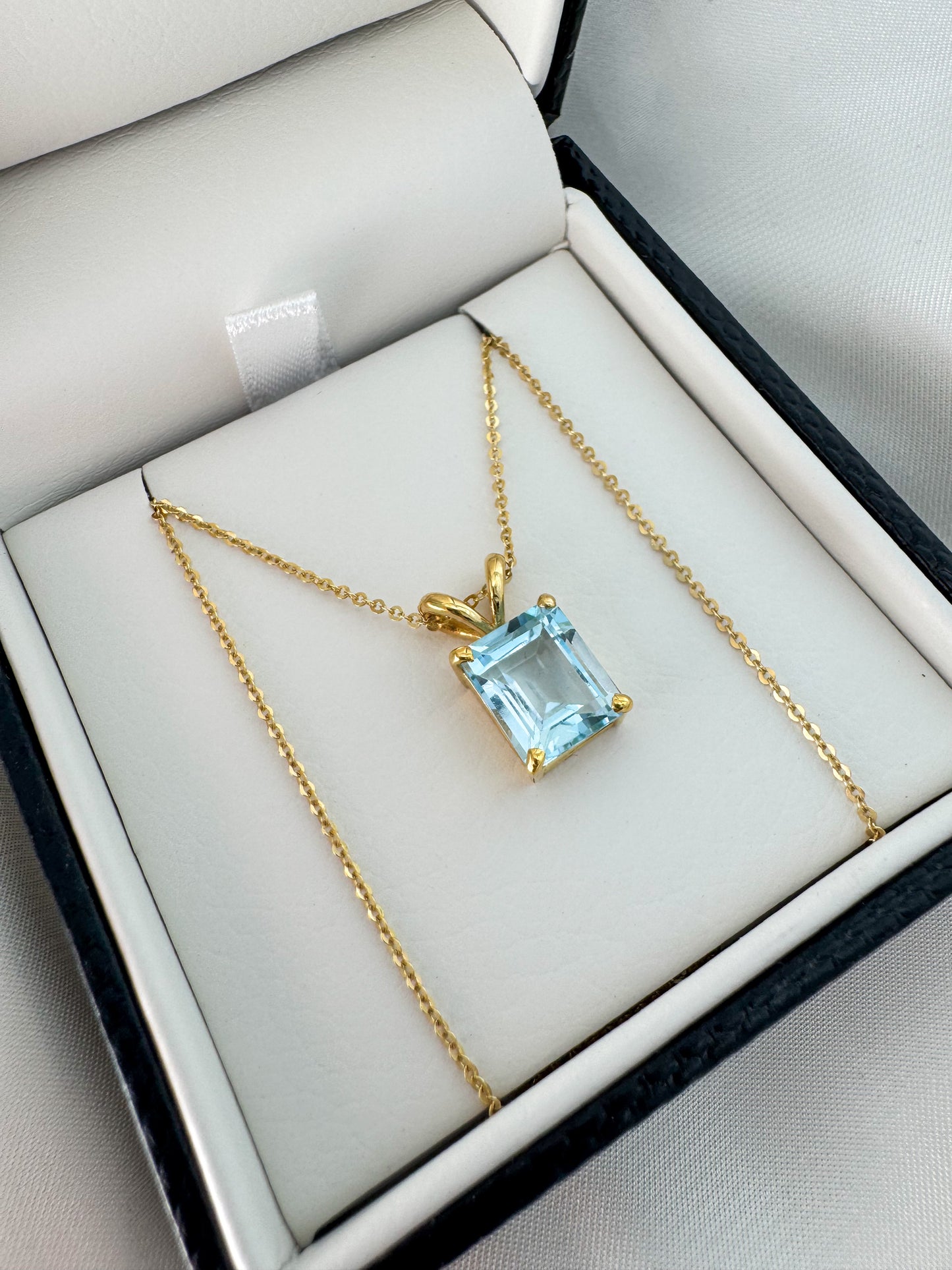 14K Gold Emerald Cut Sky Blue Topaz Pendant