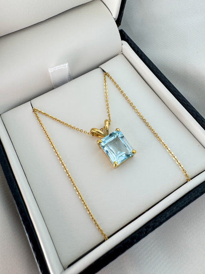 14K Gold Emerald Cut Sky Blue Topaz Pendant