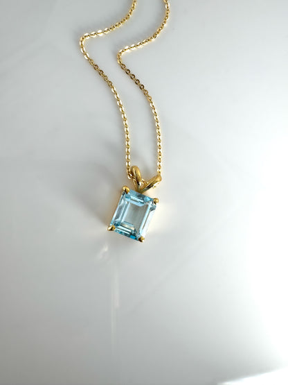 14K Gold Emerald Cut Sky Blue Topaz Pendant